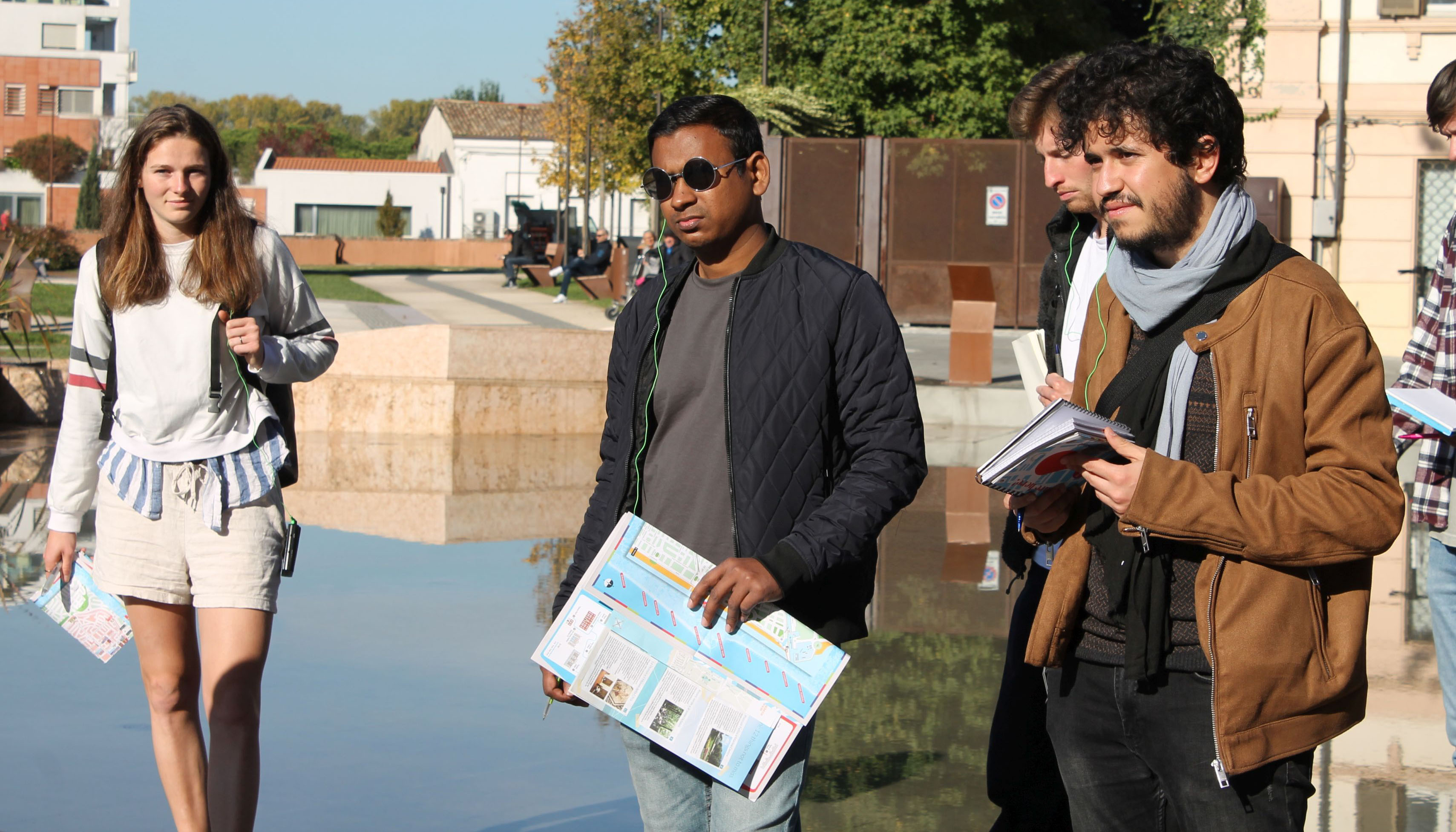 Photo group of students, background water basin and building