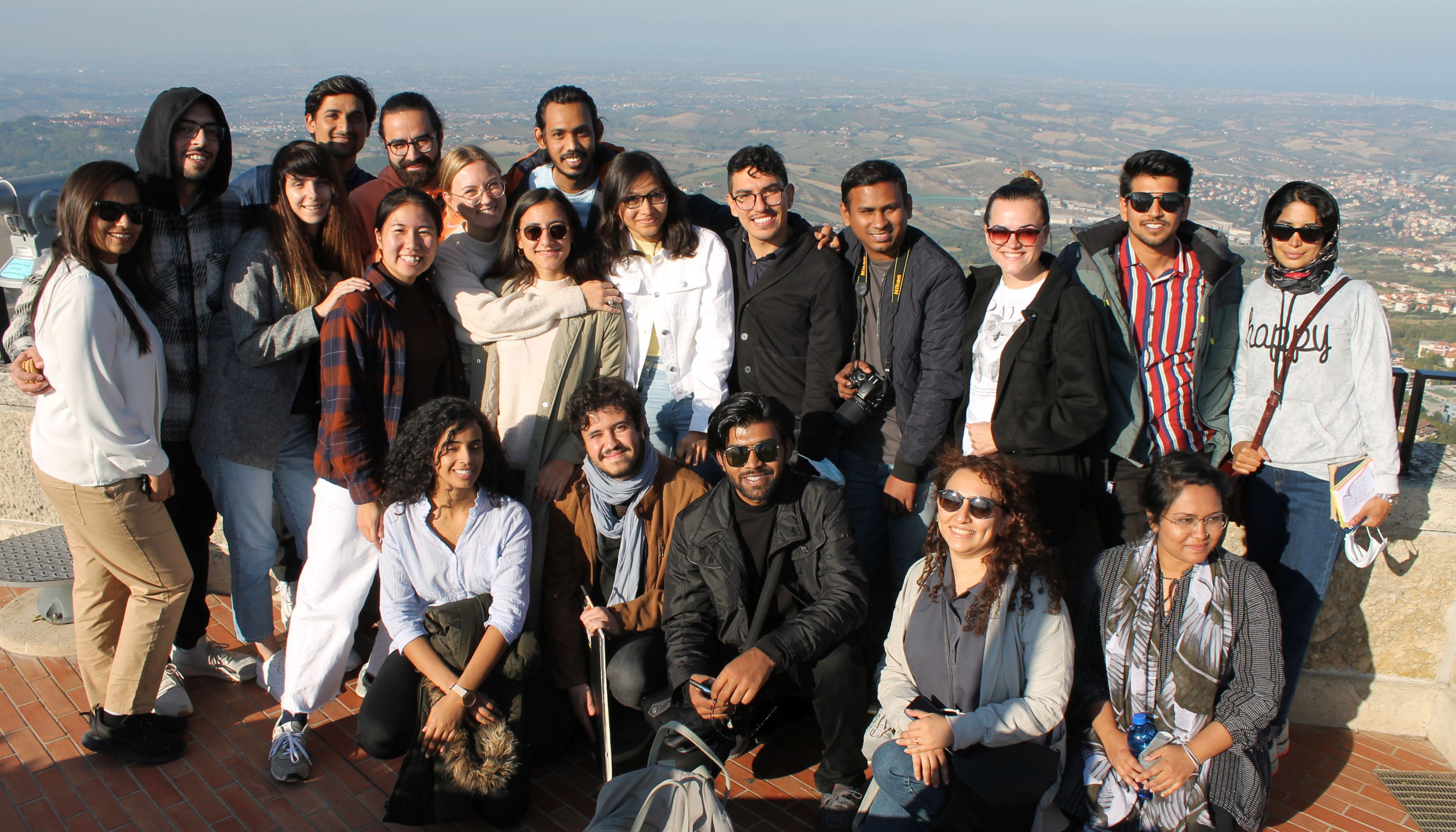 Photo group of students, background horizon city and sea