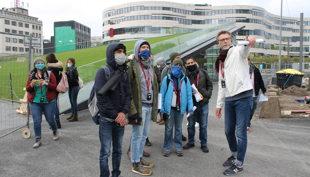 photo group of students with professor, building in the background