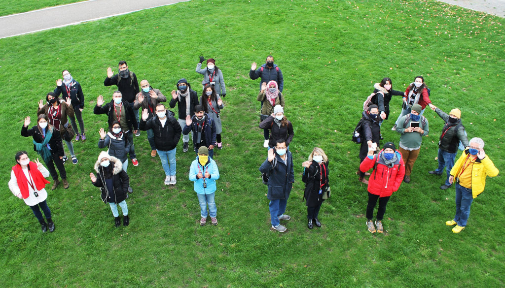 photo group of students with professor on a meadow