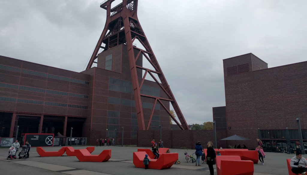 photo place with red furniture building and steel construction in the background